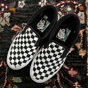 Vans Black and White Slip-On Sneakers